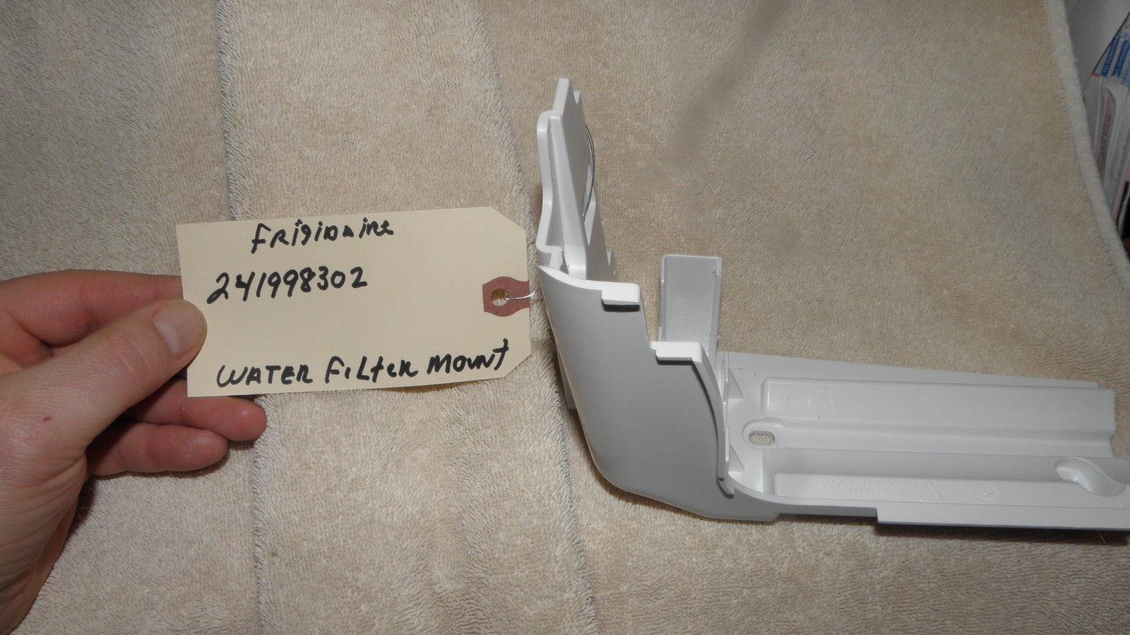 REFRIGERATOR FRIGIDAIRE ELECTROLUX 241998302 WATER FILTER MOUNT ASSEMBLY REFRIGERATOR FRIGIDAIRE ELECTROLUX 241998302 WATER FILTER MOUNT ASSEMBLY